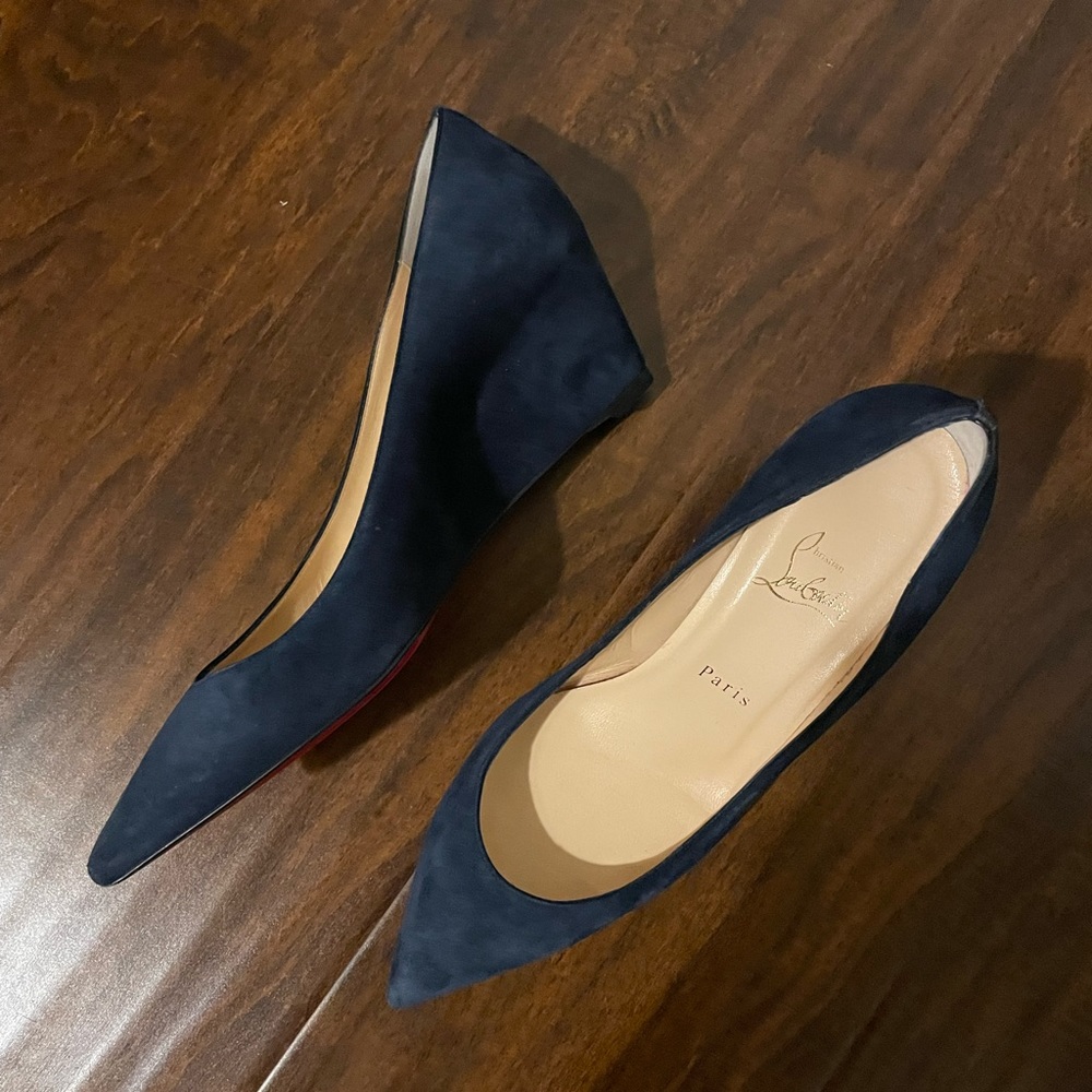Navy blue suede wedge shoes. Only been wore a couple times.